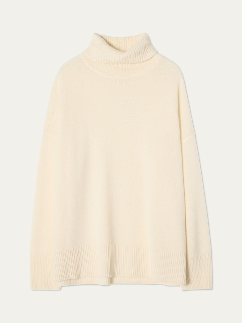 The Blefjell Sweater Women - Pure Cashmere by We Norwegians is a cream-colored, long-sleeve turtleneck with a relaxed fit and ribbed cuffs, hem, and neckline, shown on a plain white background.
