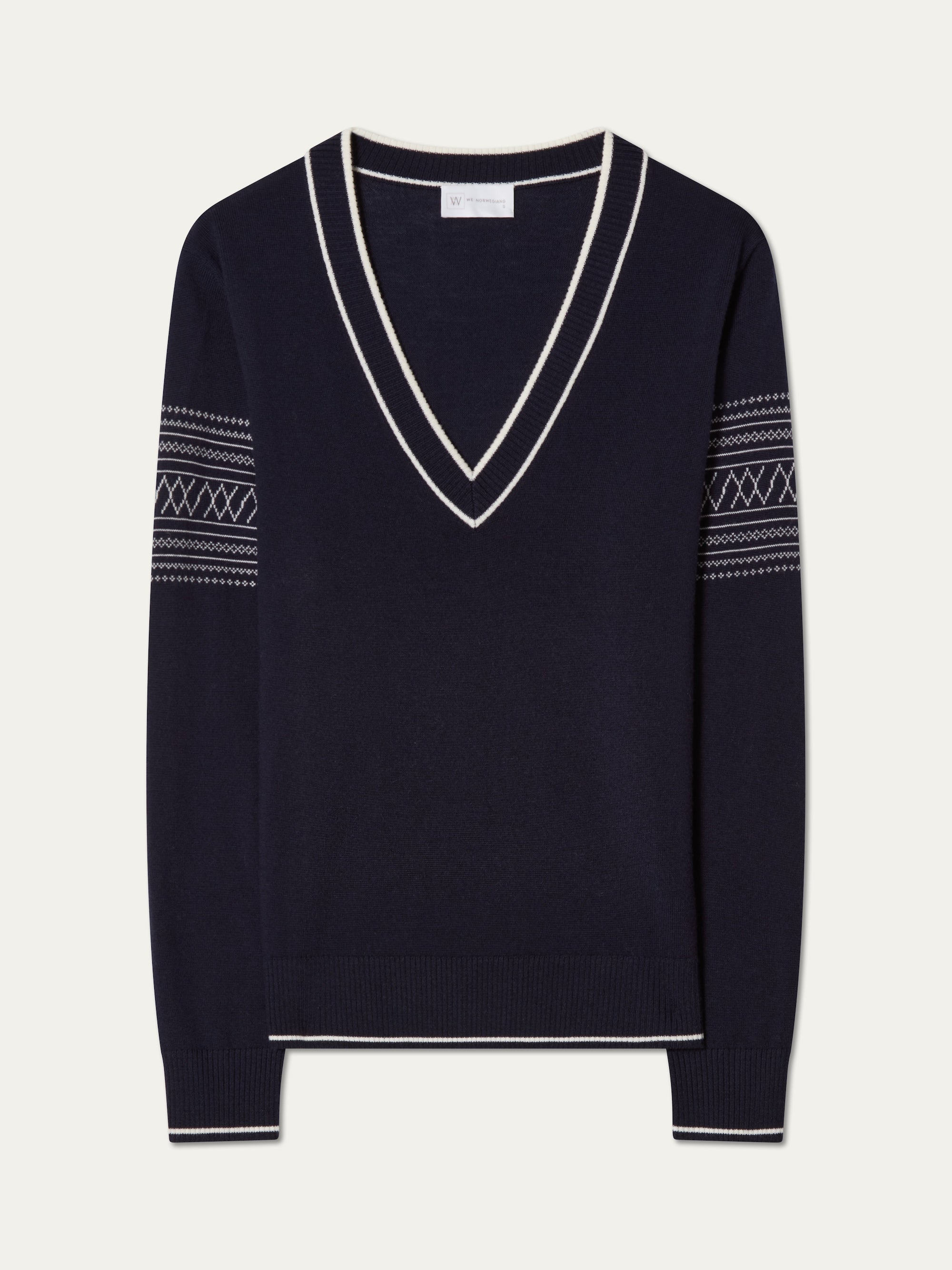 We Norwegians | FW25 | Womens Signature V-neck Sweater_Navy blue | A fine knitted sweater with white edges on the neckline, sleeves and hemline, with the signature setesdal pattern on the sleeves | Shot against an off-white background