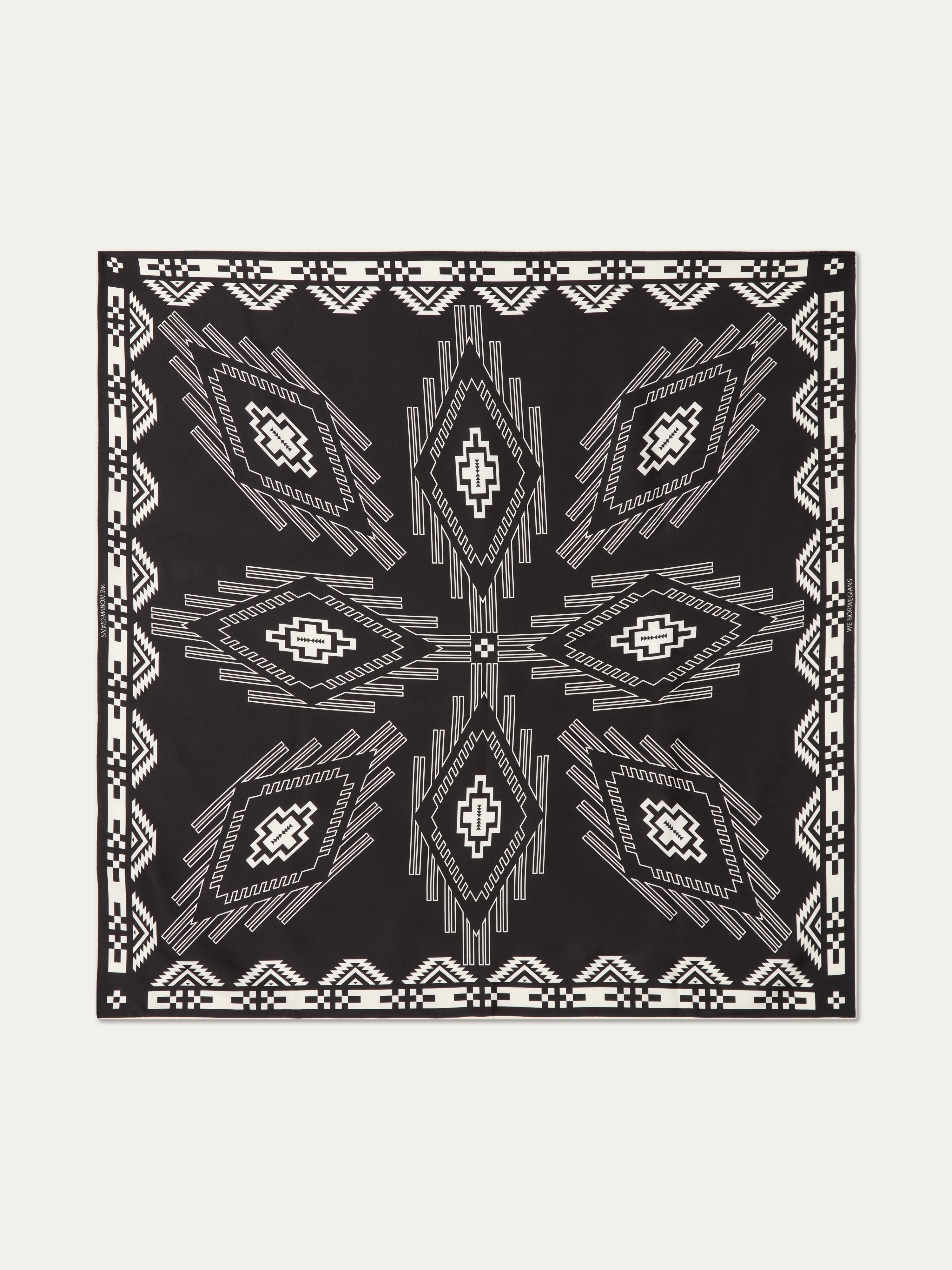 We Norwegians | FW25 | Pioneer Silk Scarf_Black | Scarf with printed motifs | Shot against an off-white background
