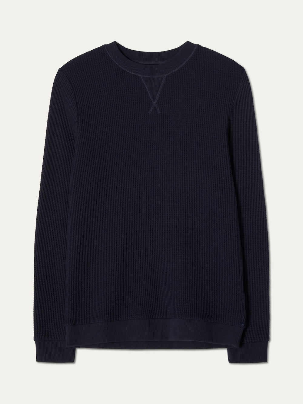 Waffle knit crewneck for men in navy blue against an off white background