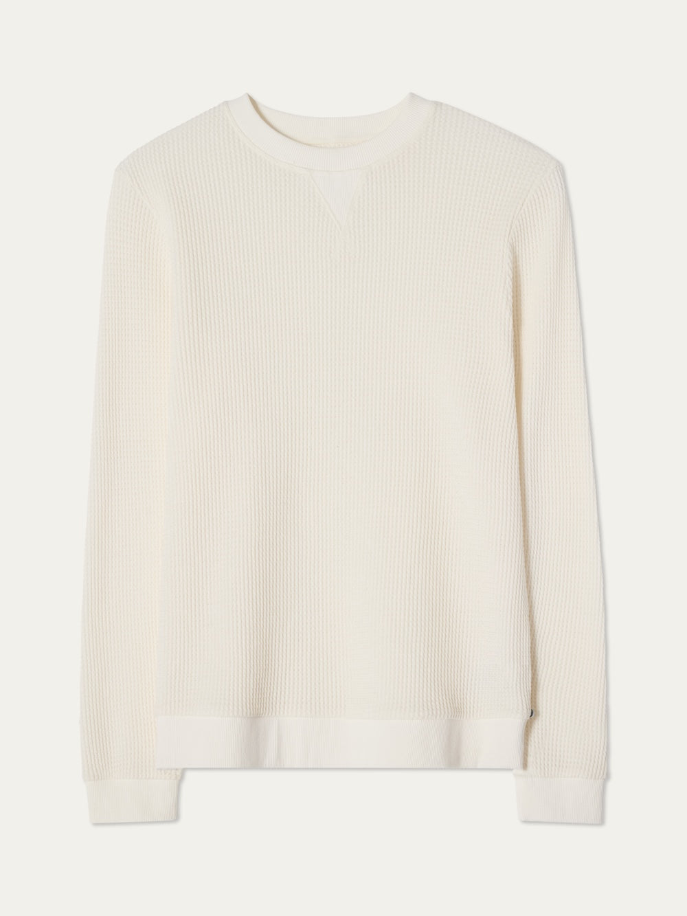 Off white waffle knit crewneck on an off white background
