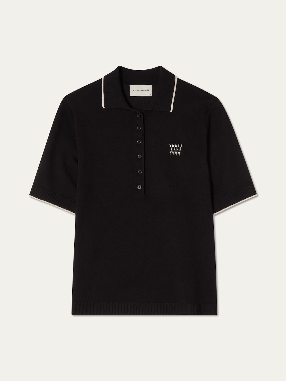Black polo shirt with white details on an off white background