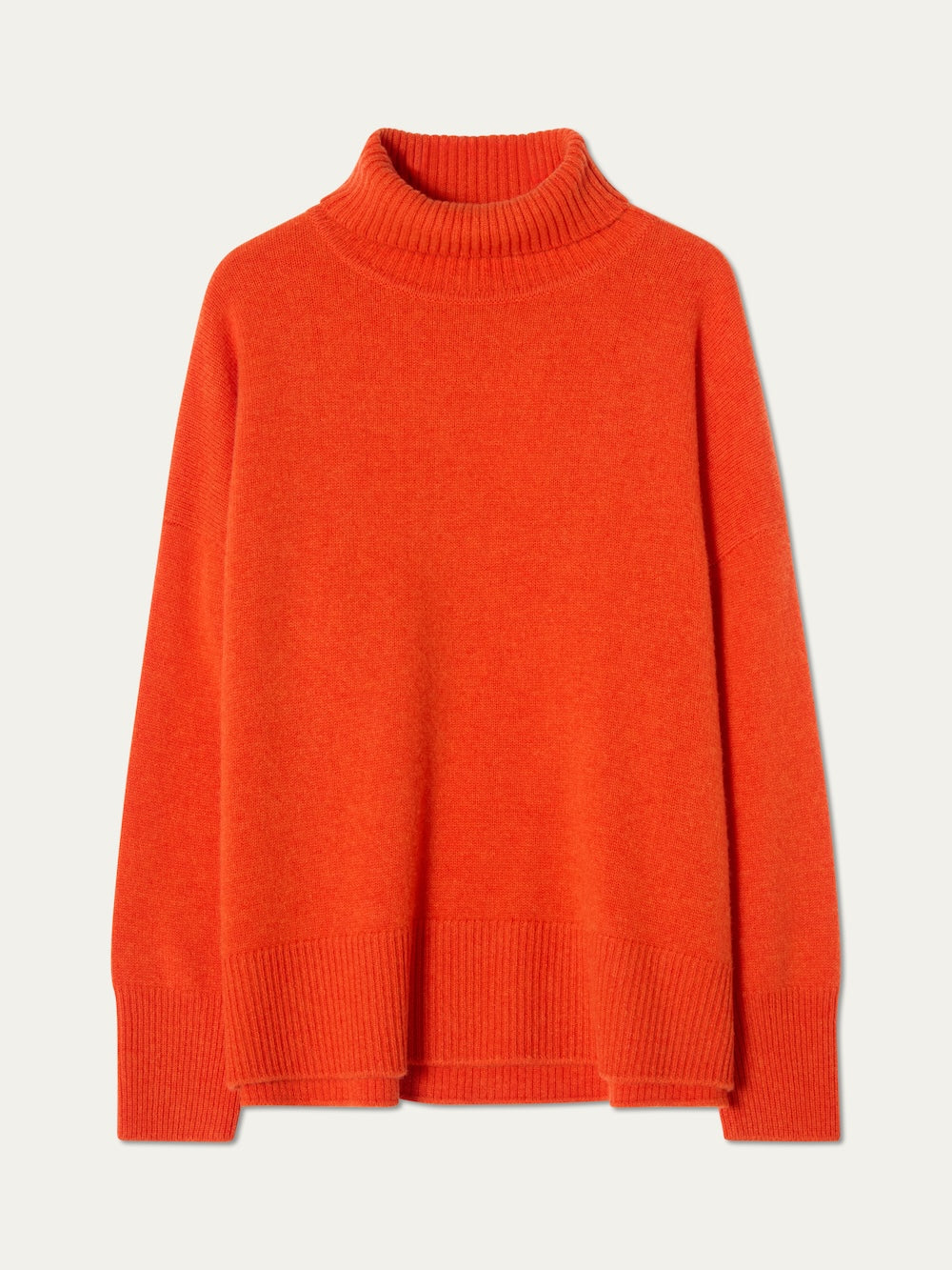 The Blefjell Sweater Women by We Norwegians is a bright orange, pure cashmere turtleneck with long sleeves and ribbed cuffs, hem, and collar—a chic piece of luxury knitwear displayed on a plain light background.
