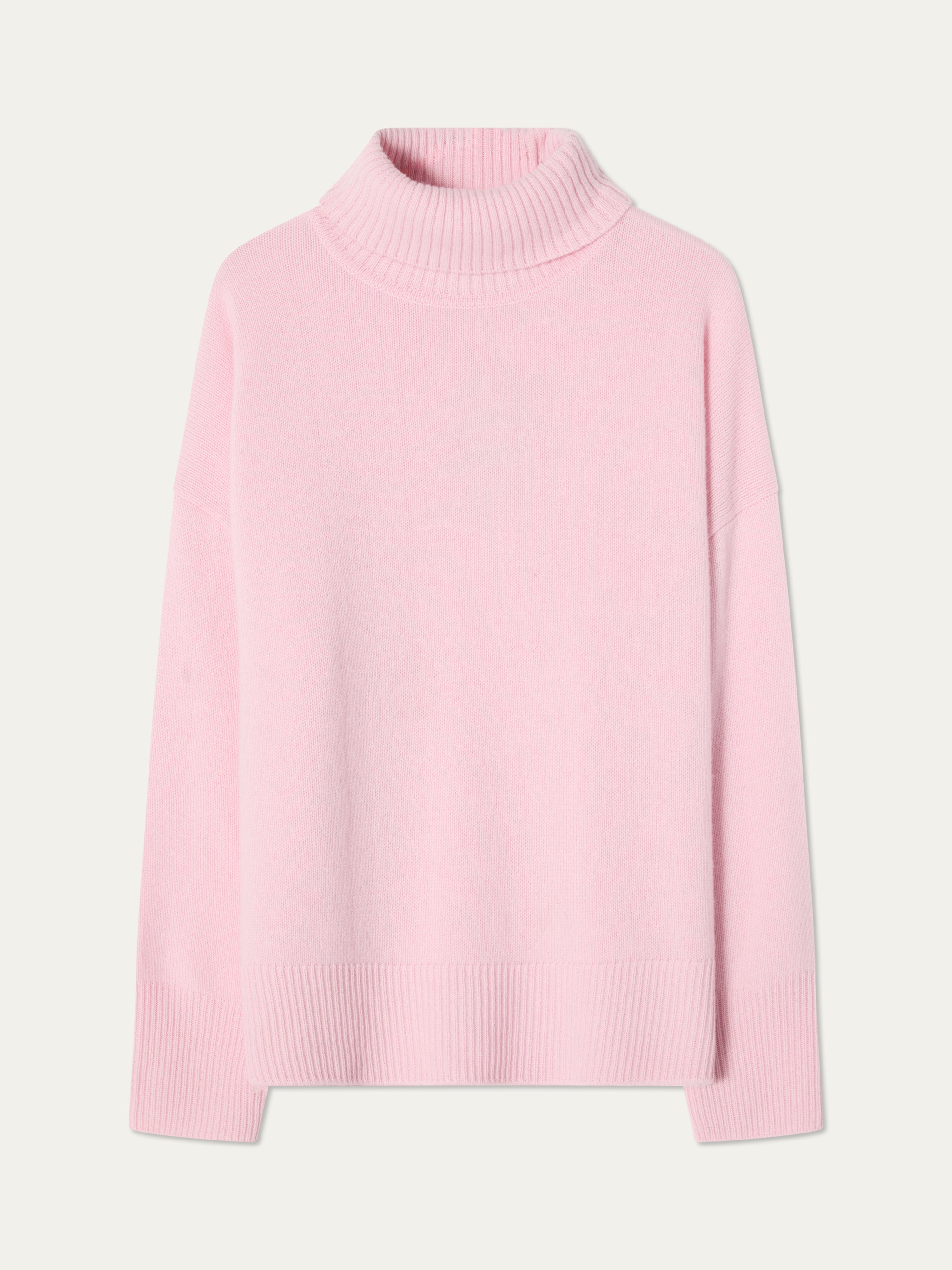 The We Norwegians Blefjell Sweater Women - Pure Cashmere is a light pink luxury knit with long sleeves, turtleneck, and ribbed cuffs, hem, and neckline, shown on a plain white background.