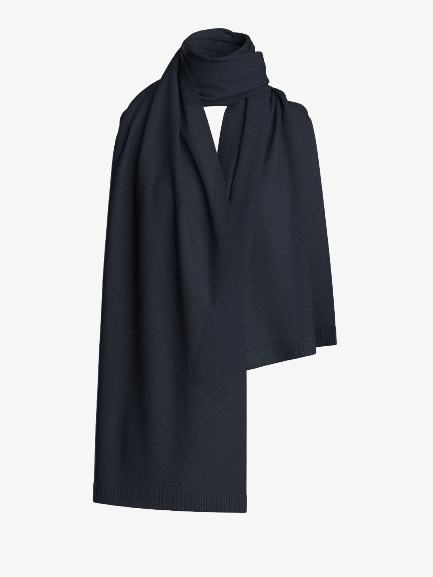 The Blefjell Scarf by We Norwegians is elegantly draped against a plain white background. Made from cashmere, the fabric looks incredibly soft with a smooth, seamless appearance, featuring minimal texture and a clean finish.