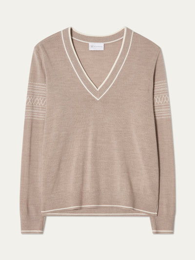 We Norwegians | FW25 | Womens Signature V-neck Sweater_Sand | A fine knitted sweater with white edges on the neckline, sleeves and hemline, with the signature setesdal pattern on the sleeves | Shot against an off-white background