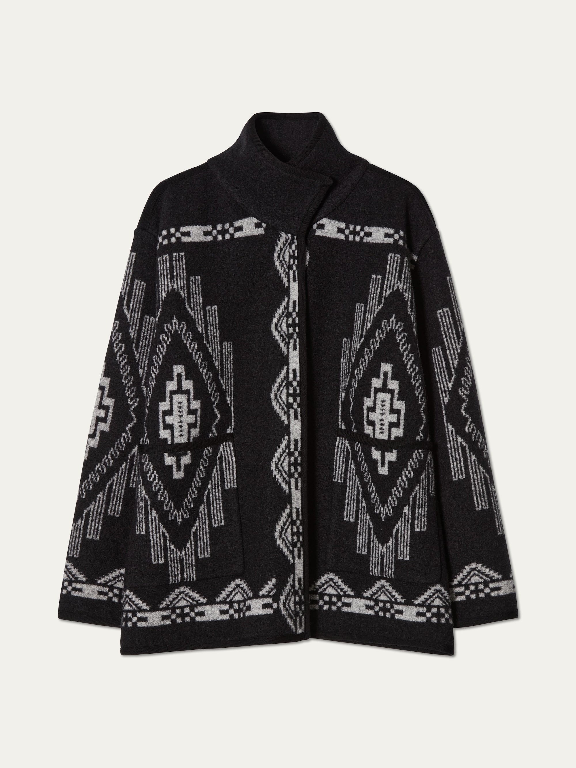 We Norwegians_FW25_Womens | Photograph of Kautokeino jacket in Black | The jacket has a bold jacquard pattern inspired by Native and Indigenous American art | Comes with Snap button opening and large front pockets