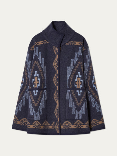 We Norwegians_FW25_Womens | Photograph of Kautokeino jacket in Navy blue | The jacket has a bold jacquard pattern inspired by Native and Indigenous American art | Comes with Snap button opening and large front pockets