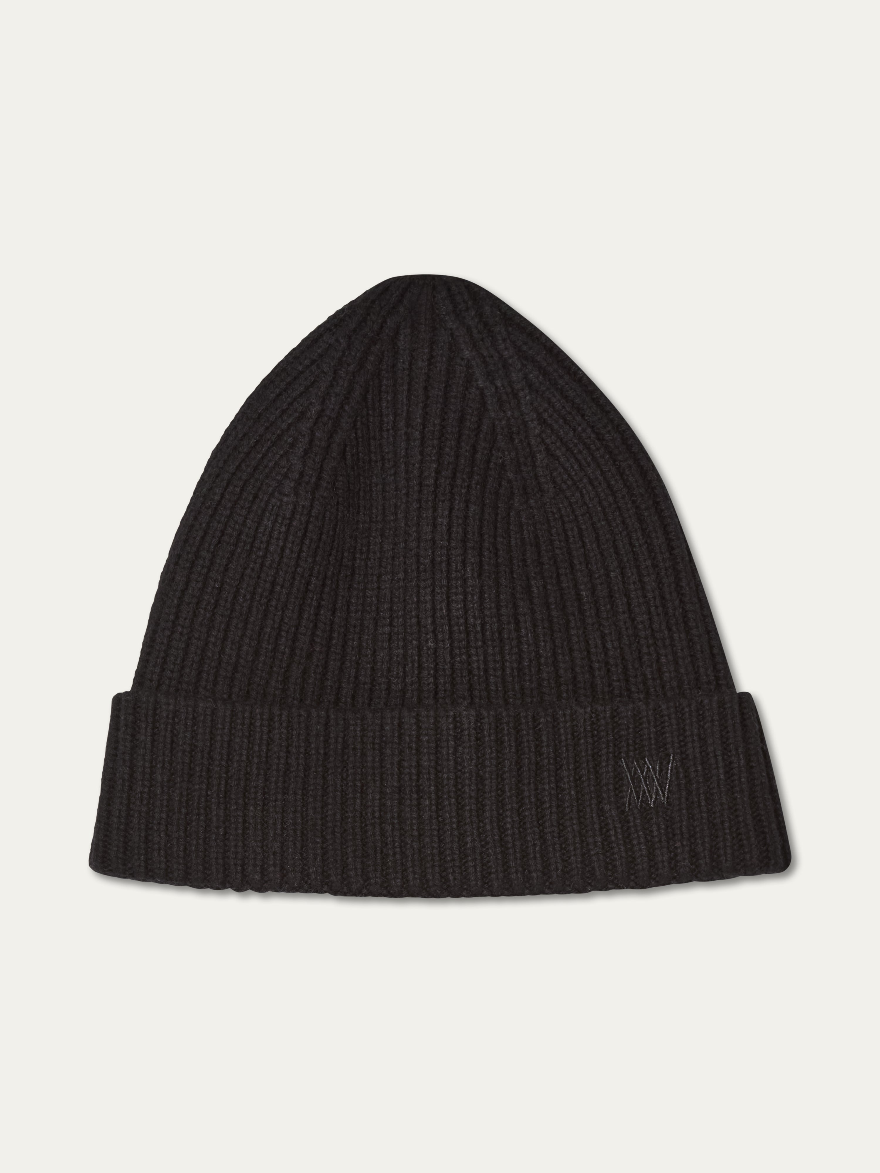 We Norwegians | FW25 | Dal Hat | A knit beanie in black on an off-white background
