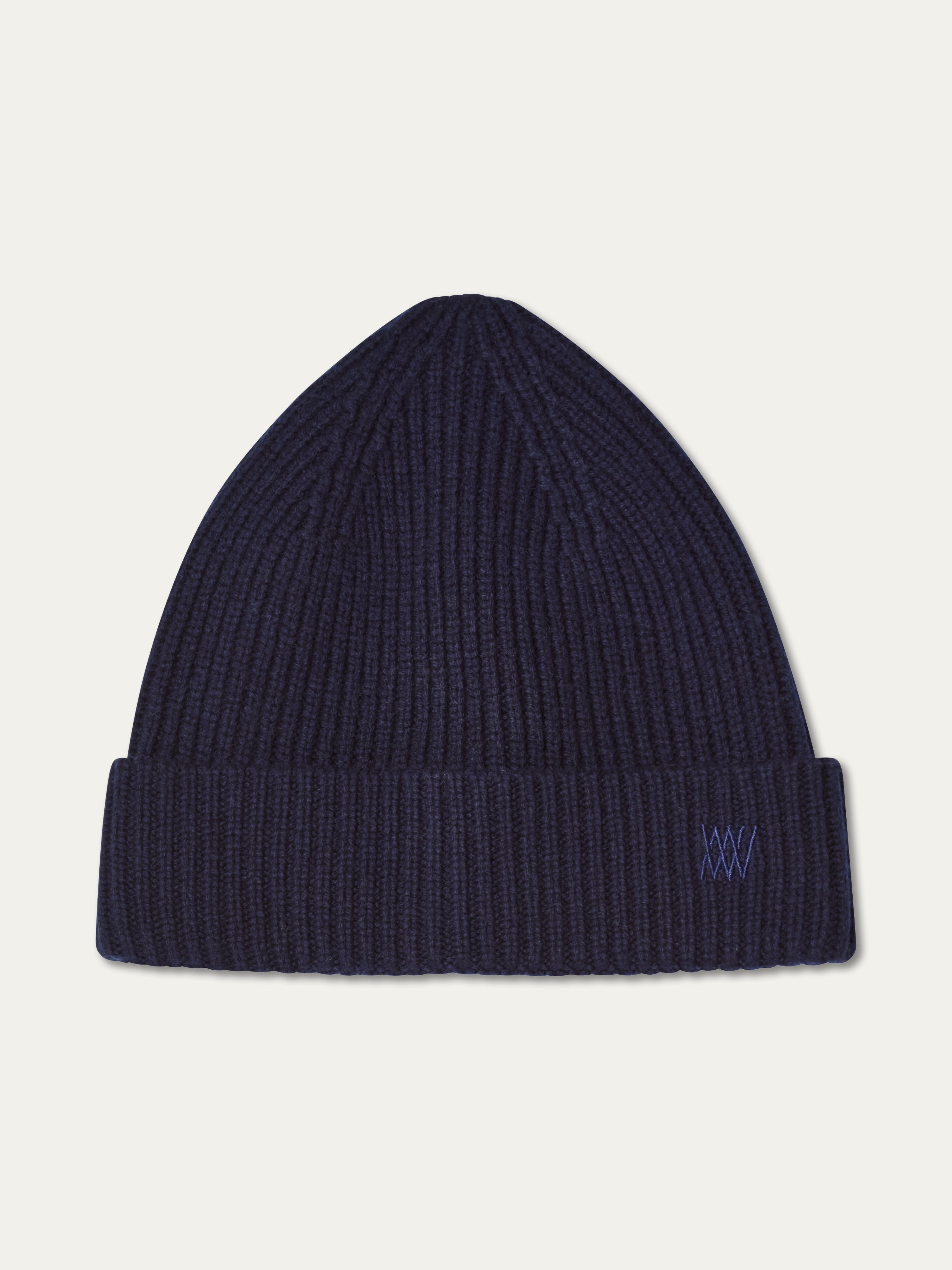 We Norwegians | FW25 | Dal Hat | A knit beanie in navy blue on an off-white background