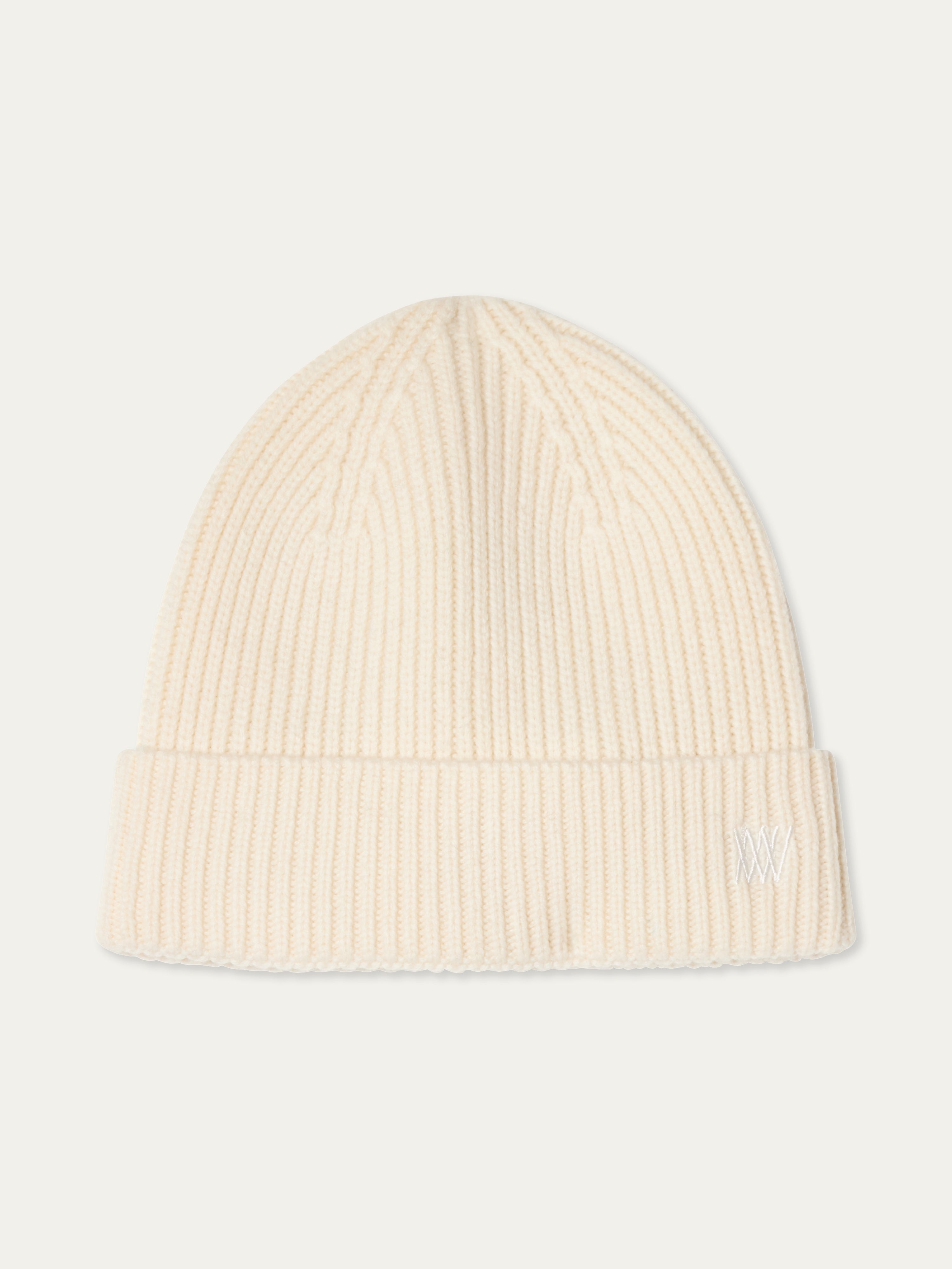 We Norwegians | FW25 | Dal Hat | A knit beanie in off-white on an off-white background