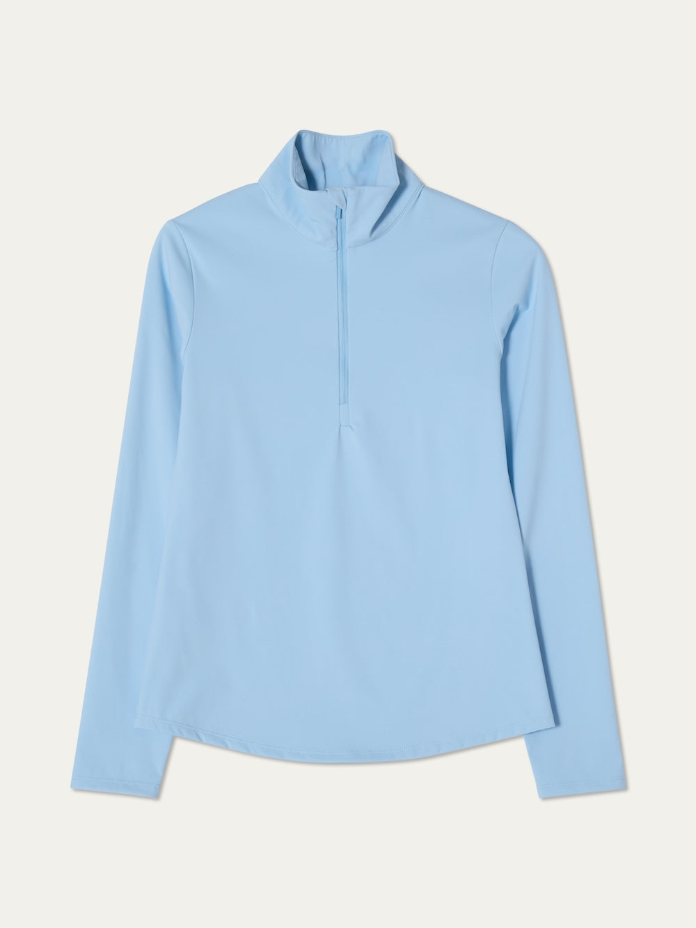 Light blue long-sleeve top on a light background