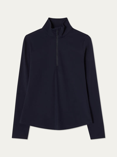 Navy blue long-sleeve top with a high collar on an off white background