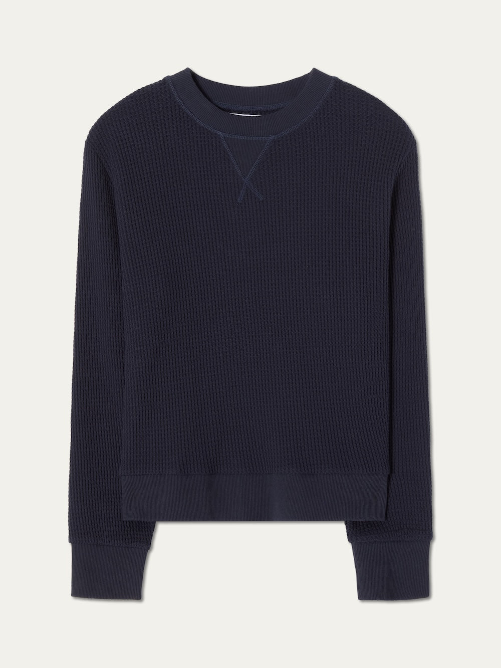 Navy blue crewneck on a light background
