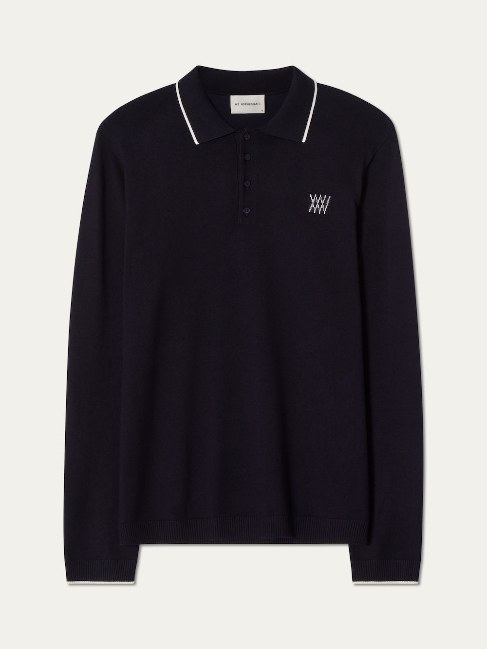 Navy blue long-sleeve polo shirt with a small logo on an off white background