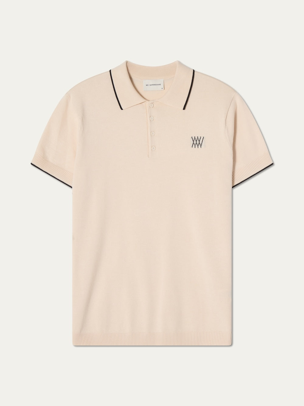 Beige polo shirt with black trim on an off white background