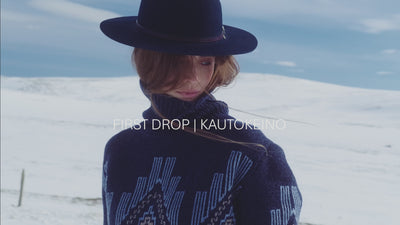 We Norwegians_FW25_Women | Model is wearing the Kautokeino sweater in navy blue | Set in snowy Geilo, Norway